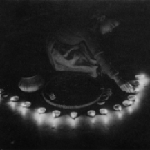 Girl laying oil lamps