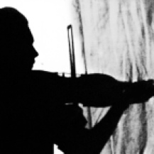 Dad with the Strad (my father playing his violin. Silhouette he took with a self-timer camera.)